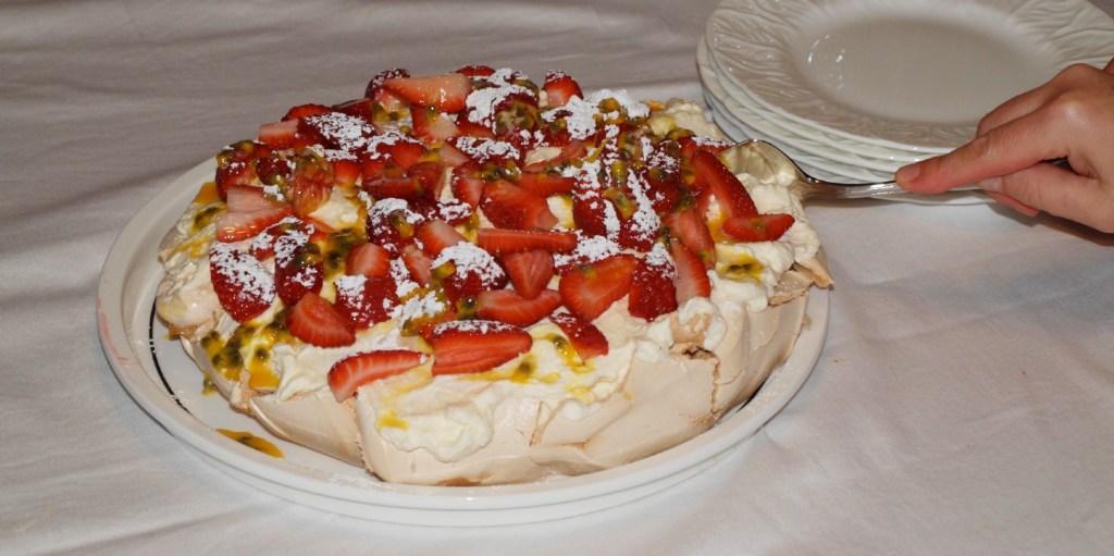Homemade pavlova a delicious dessert made from egg whites, sugar, cream and fruit